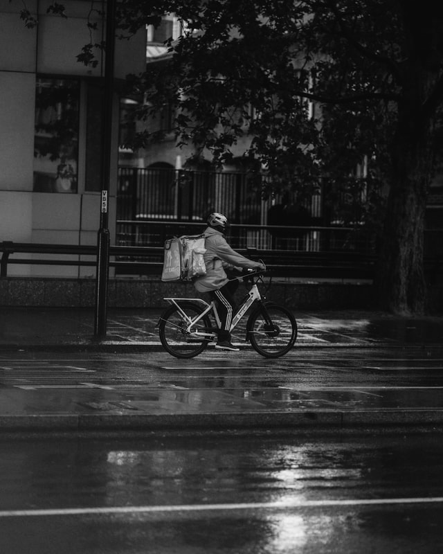 food delivery solutions worker on a bicycle